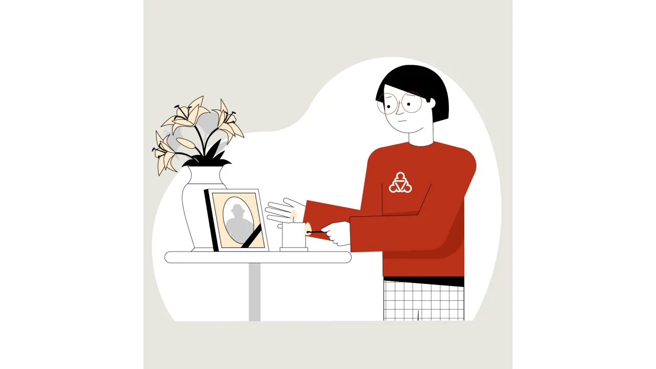 Die Wegweiserin zündet eine Kerze an. Auf dem Tisch steht das Bild mit dem Umriss einer verstorbenen Person. 